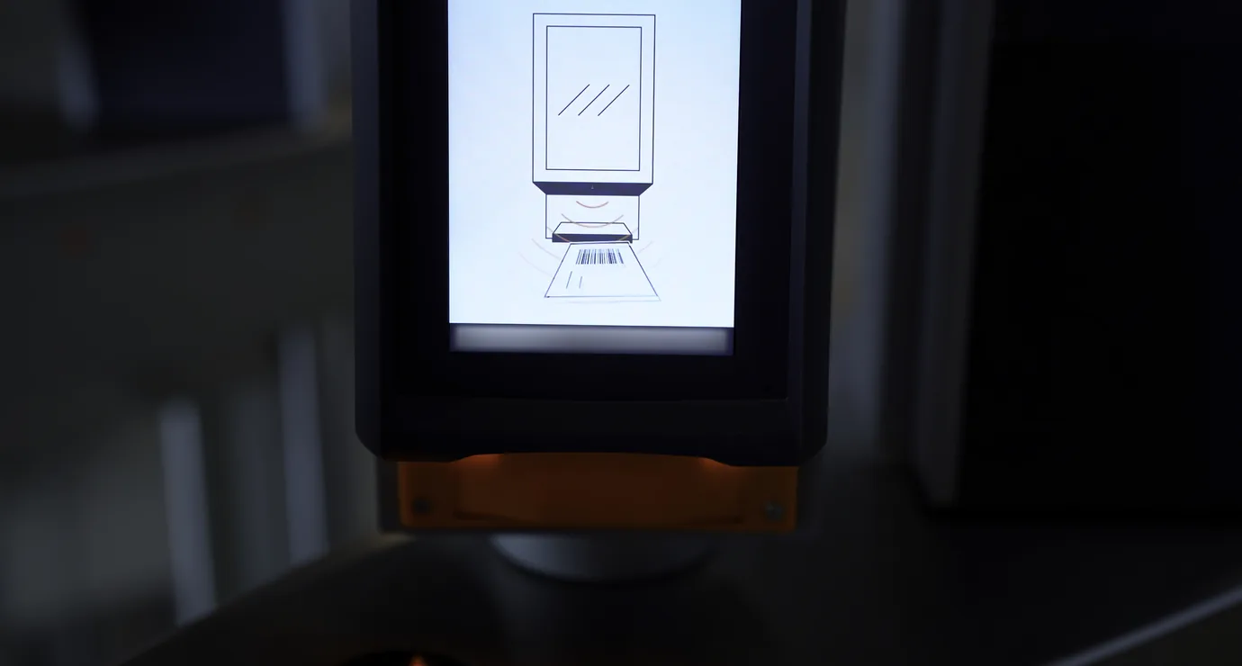 QR code being scanned at an event entry terminal