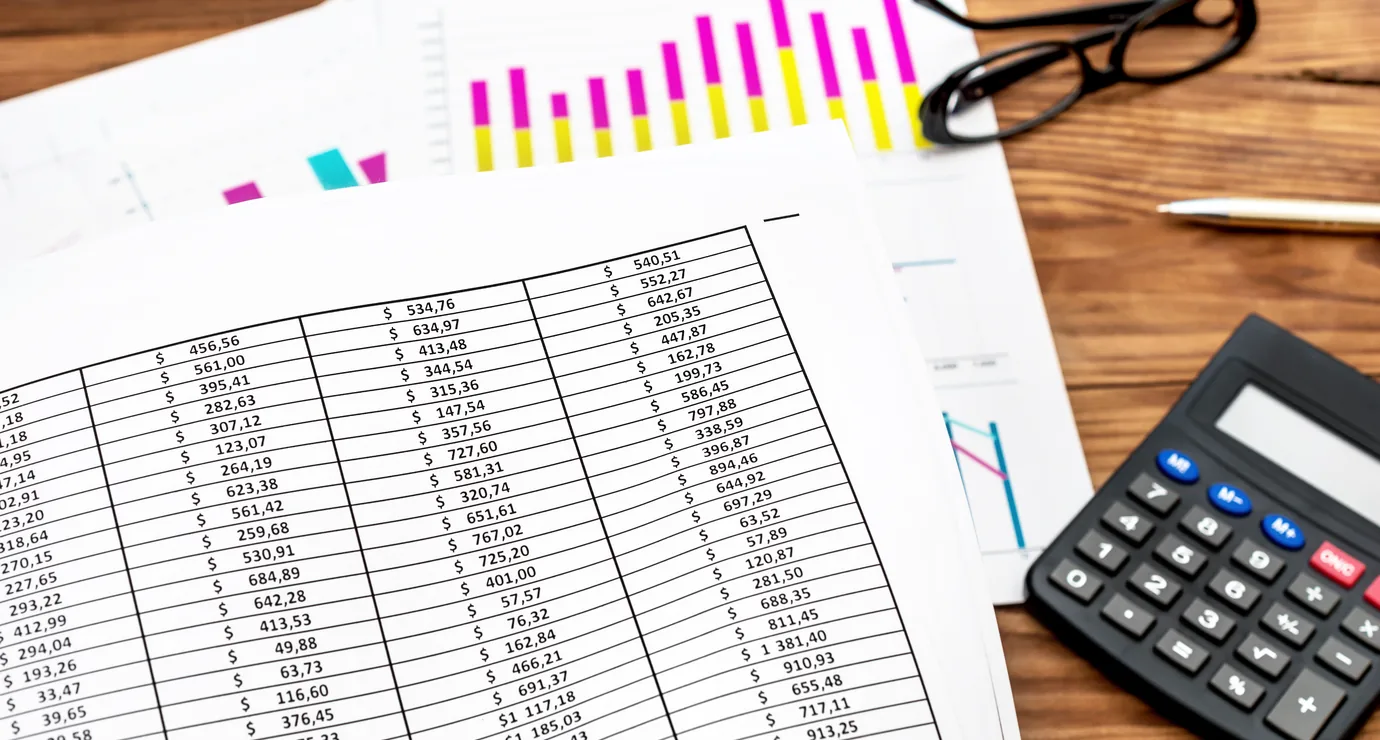 Printed cost sheets reviewed for event budget and margin