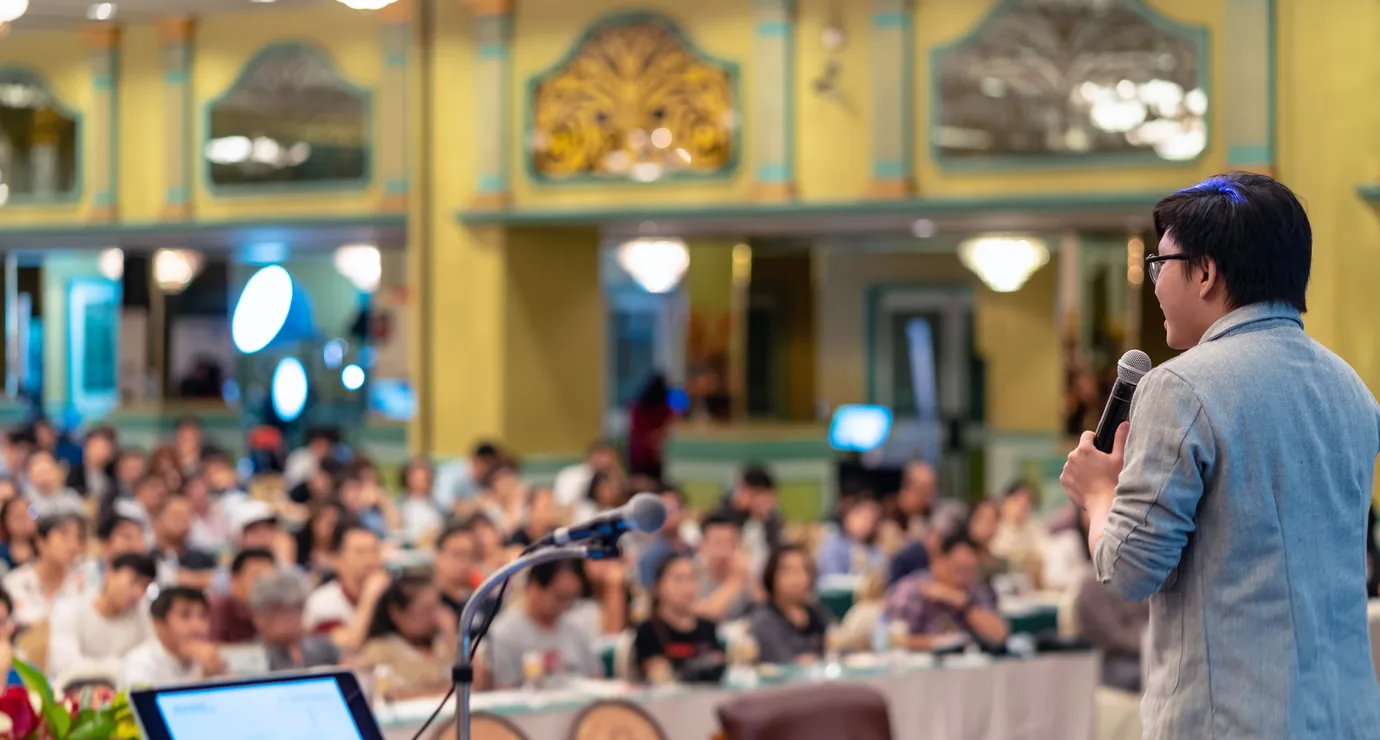 Speaker taking audience questions during a live session