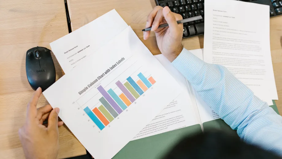 Reviewing a printed bar chart of event margin