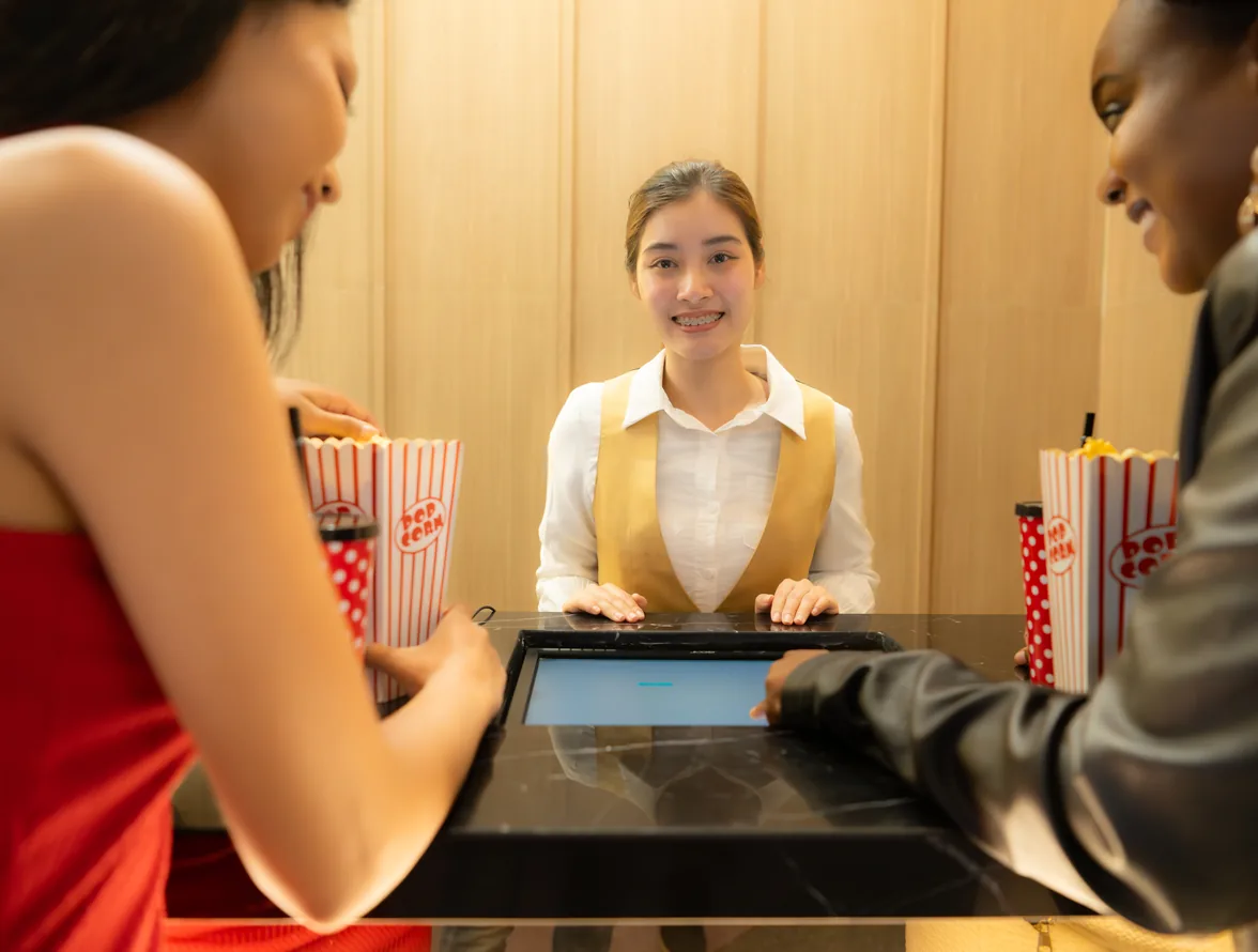 Ticket seller at a cinema box-office counter