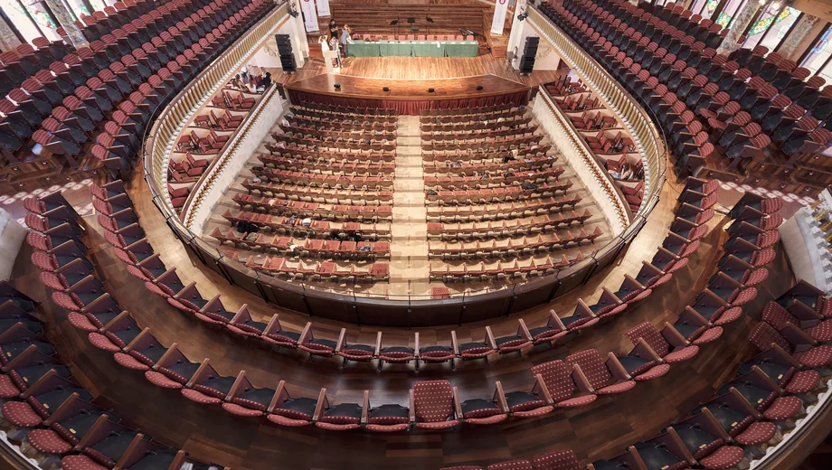 An ornate tiered auditorium that is not a simple seat grid