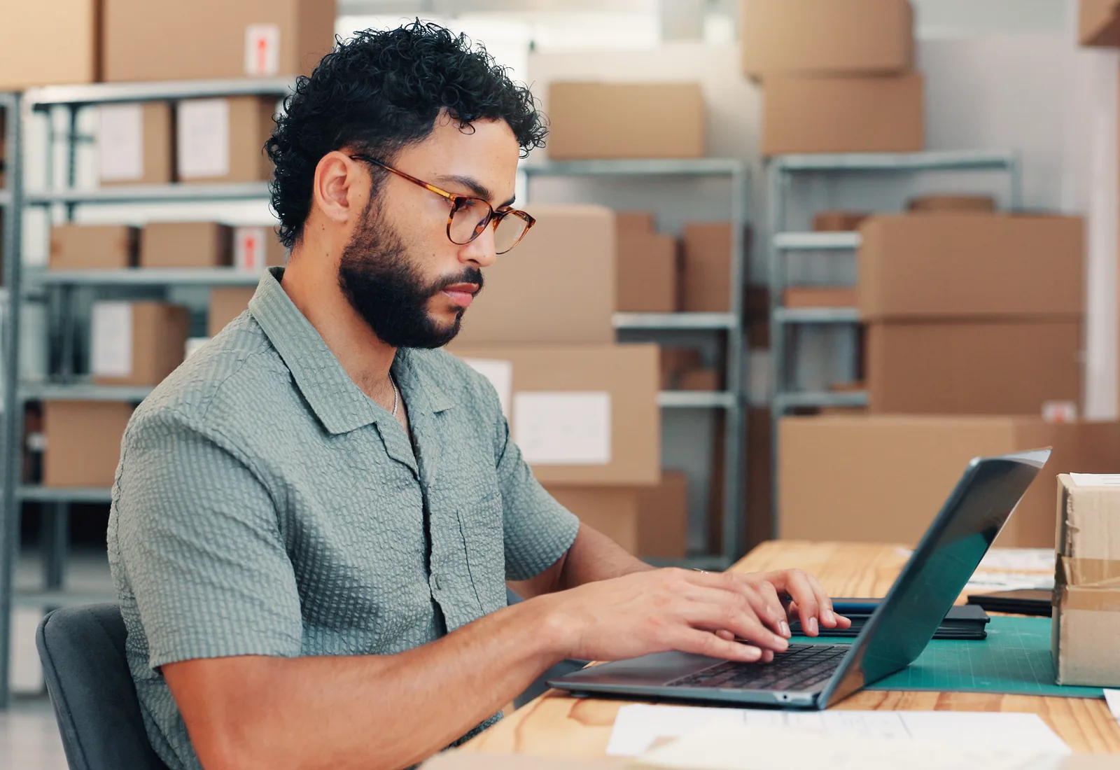 B2B ecommerce ordering portal on a laptop in a warehouse office