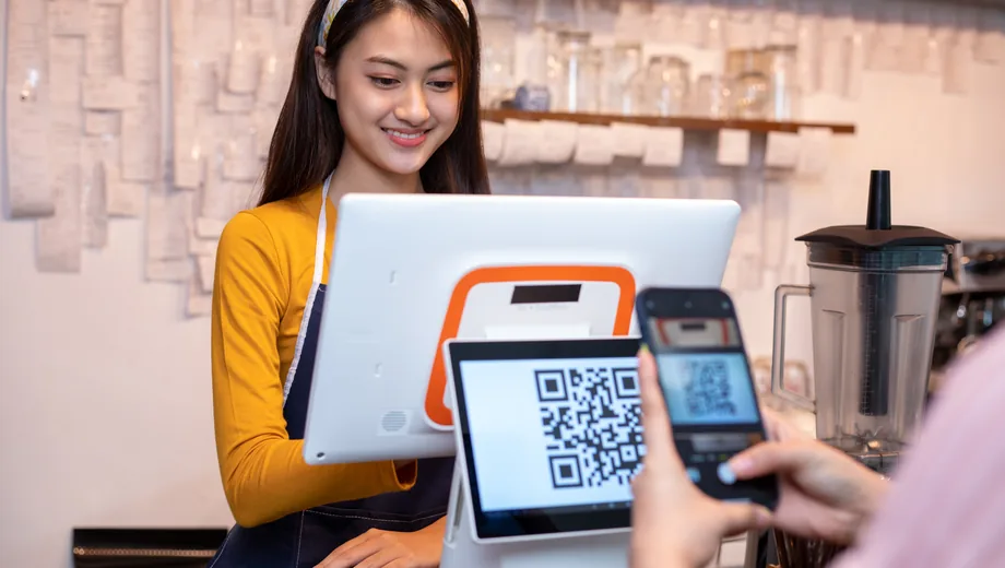 Customer completing checkout with a digital payment
