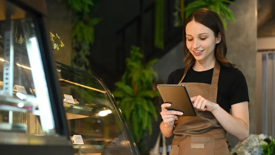 Staff updating a menu by hand across channels