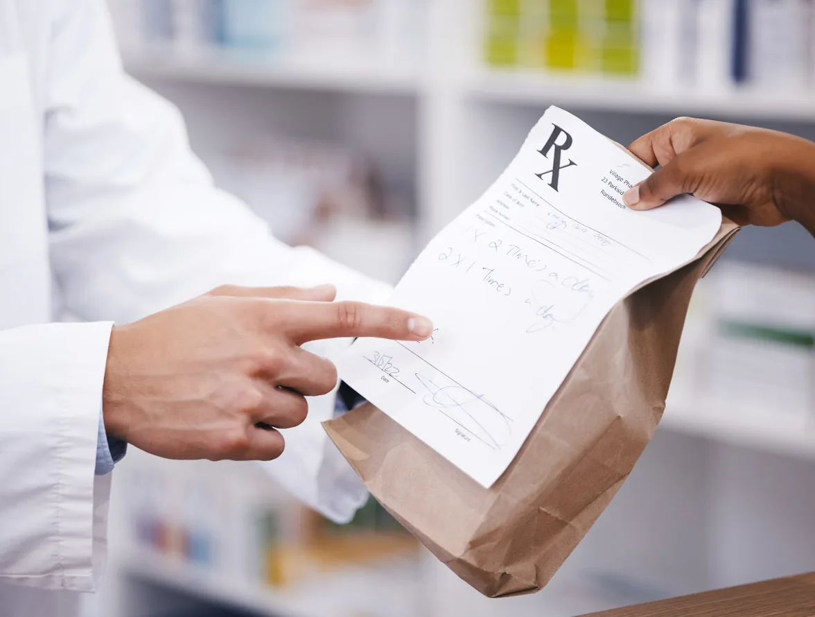 Pharmacy staff preparing a medicine order for delivery